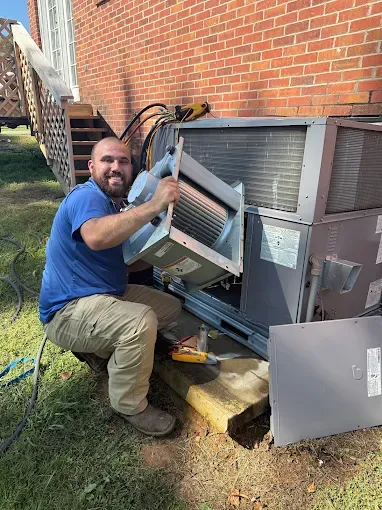 A man working on HVAC system