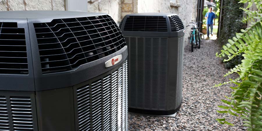Trane air conditioning condensors outside apartment complex