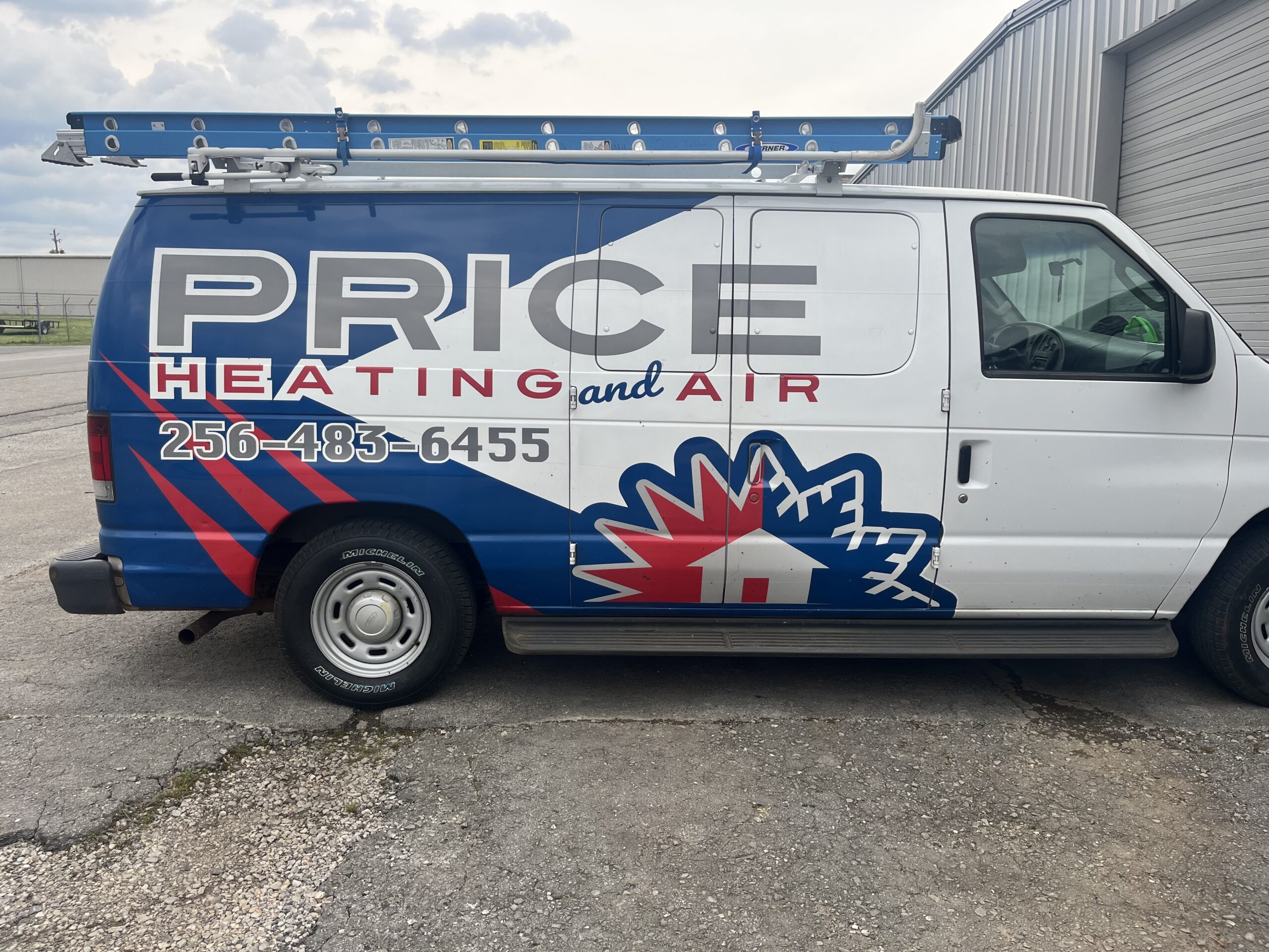 An image of a vehicle with the branding "Price Heating & Air Conditioning", a company offering HVAC supply in Muscle Shoals AL